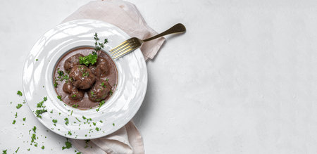 Traditional stew of homemade beef and lamb meatballs in tomato sauce and aromatic herbs. Typical Spanish foodの写真素材