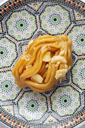 Homemade chebakias pastries, typical Moroccan sweets with honey for Ramadan and aid. halal foodの写真素材