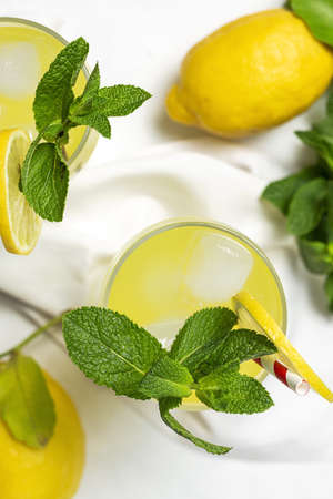 Fresh Homemade Lemonade or mojito cocktail with lemon, mint and iceの写真素材