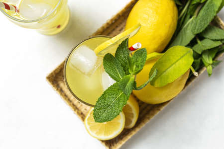 Fresh Homemade Lemonade or mojito cocktail with lemon, mint and iceの写真素材