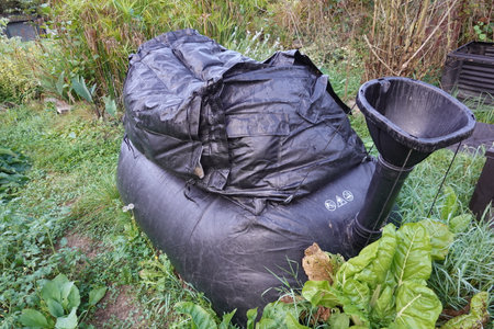 biodigester in the garden. uses of the biodigester in the home. home gas produced by the biodigester biogas biomass at homeの写真素材