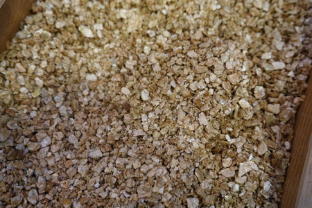 Close-up of vermiculite flakes, highlighting their texture and role in enhancing soil drainage and aeration for optimal plant growthの写真素材