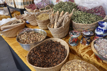 Aromatic spices and incense create a vibrant display, offering a sensory experience at a traditional marketの写真素材