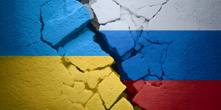 Ukraine and Russia national flags painted on a broken wall, symbolizing the ongoing division, crisis, and strained relations between nationsの素材