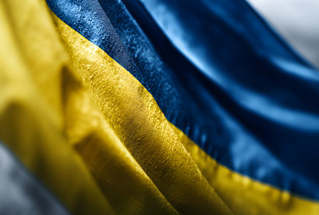 Ukrainian flag fabric displaying its iconic blue and yellow colors, symbolizing national pride, independence, and freedom of the countryの素材