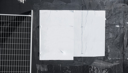 Wall with blank poster and torn posters - empty banner ready for your artwork