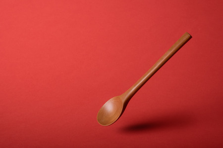Wooden spoon on White backgroundの写真素材