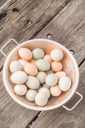 Fresh chicken eggs in basketの写真素材
