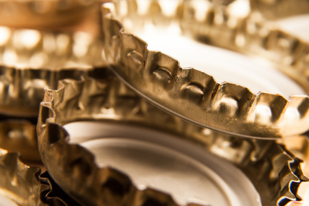 a lot of crown caps on the groundの写真素材