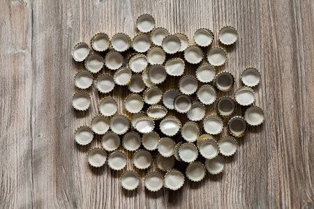 bottle caps lies on wood texture