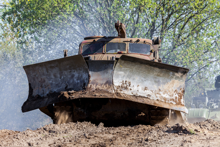 GRIMMEN/ GERMANY - MAY 1: soviet BAT - M military bulldozer drives on track on a motortechnic festival on may 1, 2016 in grimmen / Germany.のeditorial素材