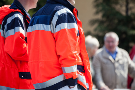 german paramedics in red Jackets on a streetの写真素材