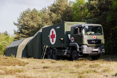 MUNSTER / GERMANY - MAY 2012: german rescue center system on trucks stands in a wood on may 2012 in munster, germany.のeditorial素材