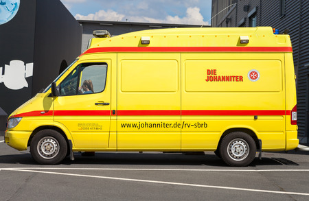 BERLIN / GERMANY - JUNE 3, 2016: german ambulance car from Johaniter stands on a building in Berlin / Germany on may 3, 2016.のeditorial素材