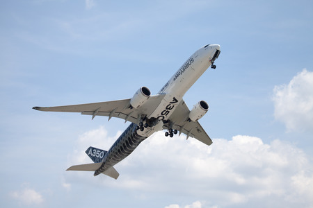 BERLIN / GERMANY - JUNE 3,2016: Airbus A 350 - 900 plane flight on airport in Berlin / Germany on June 3, 2016.のeditorial素材