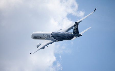 BERLIN / GERMANY - JUNE 3,2016: Airbus A 350 - 900 plane flight on airport in Berlin / Germany on June 3, 2016.のeditorial素材