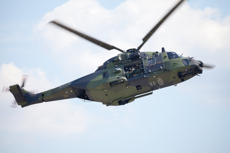 BERLIN / GERMANY - JUNE 3 2016: tactical troop helicopter NH90 from nato helicopter industries flies in berlin, germany on june 3, 2016.のeditorial素材