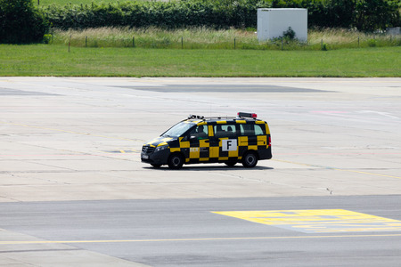 BERLIN / GERMANY - JUNE 4, 2016: german " follow me " car drives on airport schoenefeld, berlin / germany at june 4, 2016のeditorial素材