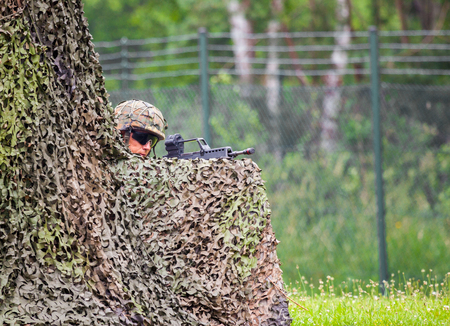 BURG / GERMANY - JUNE 25, 2016: german soldier fires with hk g 36 rifle, on open day in barrack burg / germany at june 25, 2016のeditorial素材