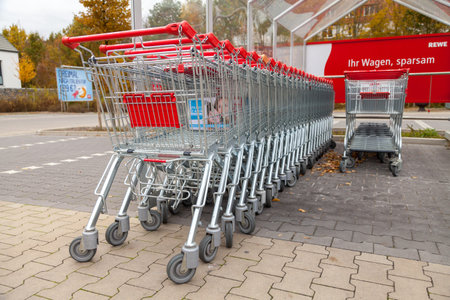 HANNOVER / GERMANY - OCTOBER 30, 2016: Shopping carts of the german supermarket chain, Rewe stands...