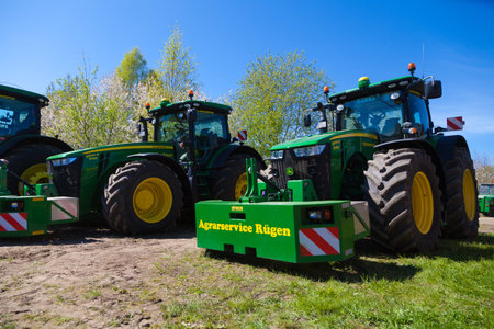 GRIMMEN / GERMANY - MAY 5, 2016: john deere tractor stands on tractor show in grimmen / germany at...