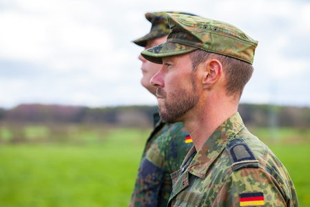 two german soldiers looks to the sideの写真素材