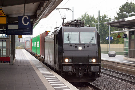 a black german good train on station