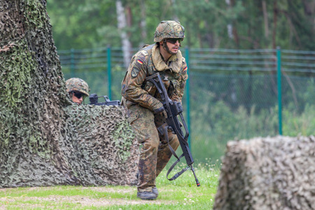 BURG / GERMANY - JUNE 25, 2016: german soldier with hk g 36 rifle on assault course , at open day in barrack burgのeditorial素材
