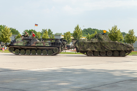 BURG / GERMANY - JUNE 25, 2016: german armored recovery vehicle, Bergepanzer 2 pulls a damaged tank at open day in barrack burgのeditorial素材