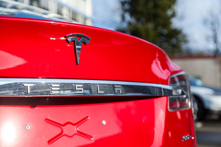 FUERTH / GERMANY - MARCH 4, 2018: Tesla logo on a Tesla car Tesla, Inc. is an American company that specializes in electric automotives, energy storage and solar panel manufacturing.のeditorial素材