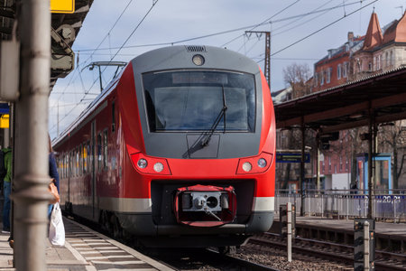 a german train passes a train station