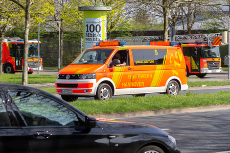 HANNOVER / GERMANY - APRIL 18, 2018: German fire service vehicles from the professional fire department drive to a deployment site.のeditorial素材
