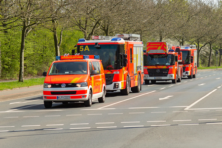 HANNOVER / GERMANY - APRIL 18, 2018: German fire service vehicles from the professional fire department drive to a deployment site.のeditorial素材