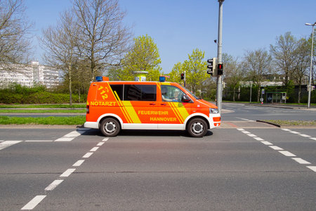 HANNOVER / GERMANY - APRIL 18, 2018: German ambulance drives to a place of employment