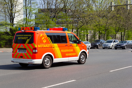 HANNOVER / GERMANY - APRIL 18, 2018: German ambulance drives to a place of employmentのeditorial素材
