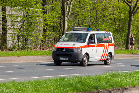 HANNOVER / GERMANY - APRIL 18, 2018: German ambulance drives to a place of employment