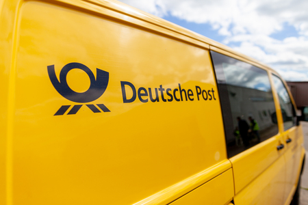 ALTENTREPTOW / GERMANY MAY 1, 2018: Transport vehicle Volkswagen T5 from Deutsche Post ( german post ) stands on a street.のeditorial素材