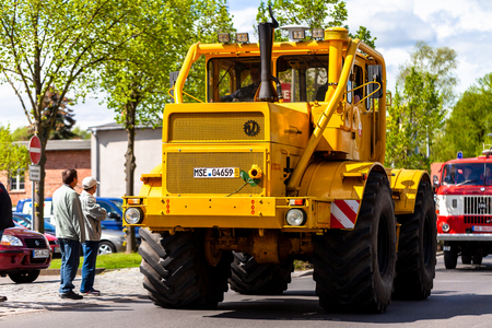 ALTENTREPTOW MECKLENBURG- WEST POMERANIA - MAY 1, 2018: Russian Kirowez K 700A tractor drives on street at an oldtimer showのeditorial素材
