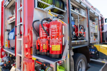 Delmenhorst / Germany - MAY 6, 2018: Extinguisher from GLORIA stands on a drawer from a german fire engine. Feuerloescher means extinguisher.のeditorial素材