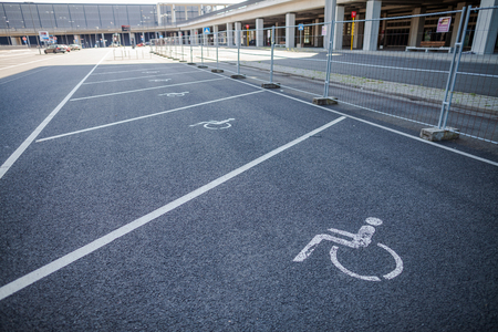 BERLIN / GERMANY - APRIL 29, 2018: Disabled parking space on Passenger terminal Berlin Brandenburg airport, Willy Brandt. The BER is an international airport under construction.のeditorial素材