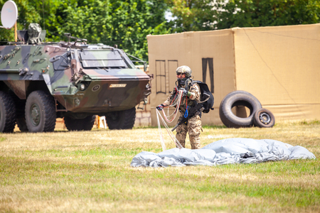 FELDKIRCHEN / GERMANY - JUNE 9, 2018: Paratrooper from Bundeswehr, german army lands on an open day on day of the Bundeswehr in Feldkirchenのeditorial素材