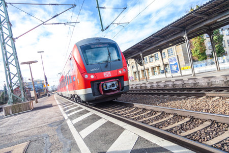 FUERTH / GERMANY - MARCH 11, 2018: RE Regional Express train from Deutsche Bahn passes train station...