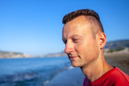 ALANYA / TURKEY - SEPTEMBER 30,2018: A german man sits on a coast in Anlanyaのeditorial素材