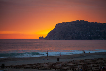 ALANYA / TURKEY - SEPTEMBER 30, 2018: A beautiful sunset scene on Alanya beach in Turkeyのeditorial素材