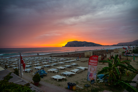 ALANYA / TURKEY - SEPTEMBER 30, 2018: A beautiful sunset scene on Alanya beach in Turkeyのeditorial素材
