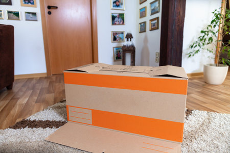 Moving box is folded up in an apartment