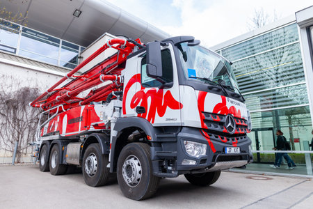 MUNICH / GERMANY - APRIL 14, 2019: Mercedes Benz truck with a concrete pump stands in front of a...