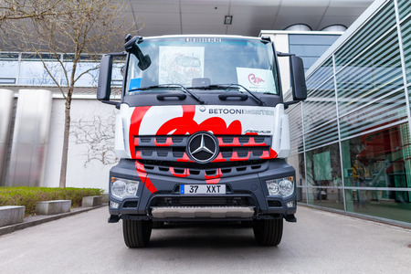 MUNICH / GERMANY - APRIL 14, 2019: Mercedes Benz truck with a concrete pump stands in front of a hall in Munich.のeditorial素材
