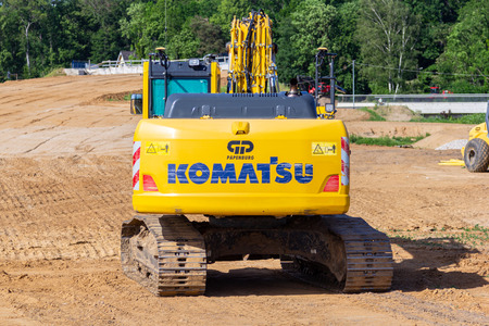 HANOVER / GERMANY - JUNE 2,2019: Komatsu excavator stands on a construction site in Hanover.のeditorial素材