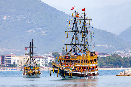 ALANYA / TURKEY - JUNE 3, 2019: Pirate party ship sails on the coast of Alanya, Turkey.のeditorial素材